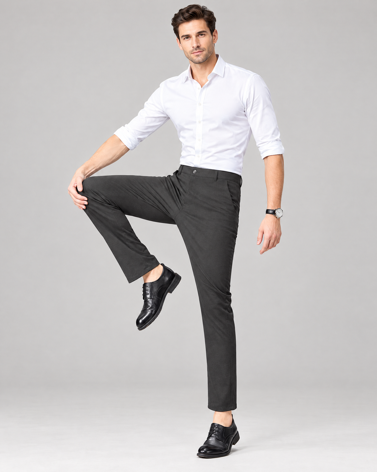 Men's dark grey stretch chino dress pants with white shirt and black shoes