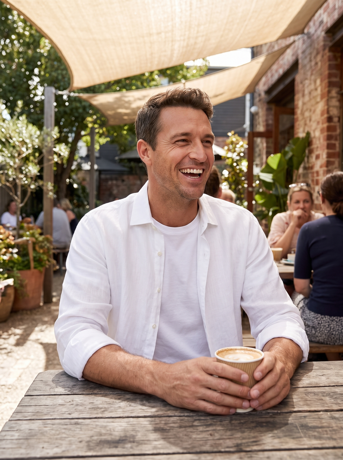 Man wearing Cassian linen shirt layered over tee lifestyle