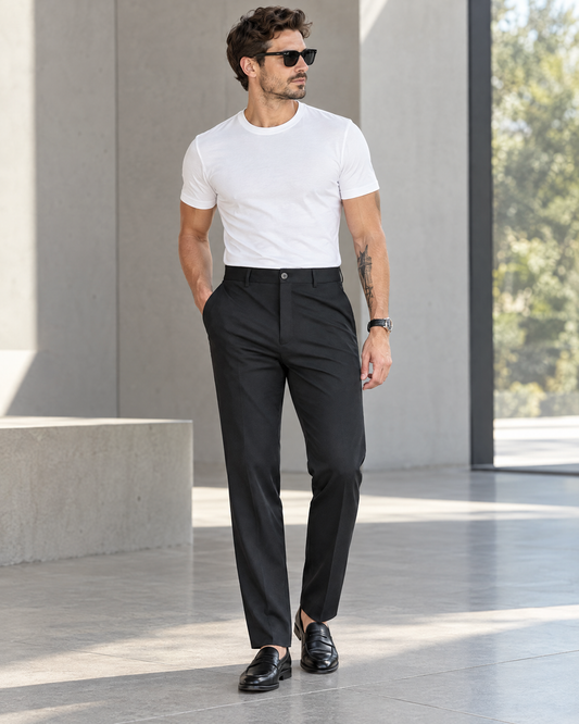Men's black stretch slim straight dress pants styled with white tee and loafers