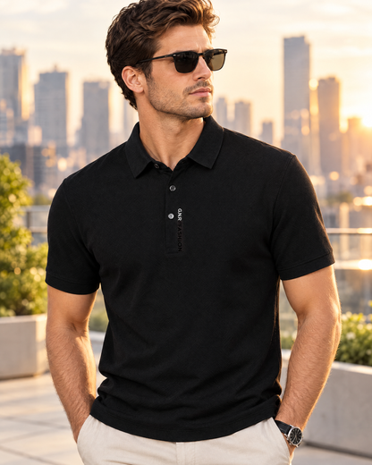 Men's black short sleeve knit polo shirt with ribbed collar worn on a city terrace