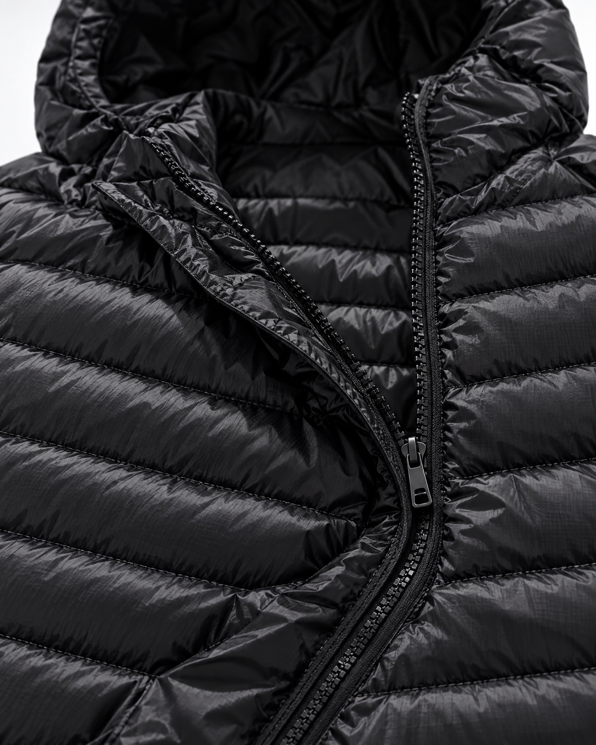 Quilted baffles, hood and zipper of men's black lightweight puffer jacket