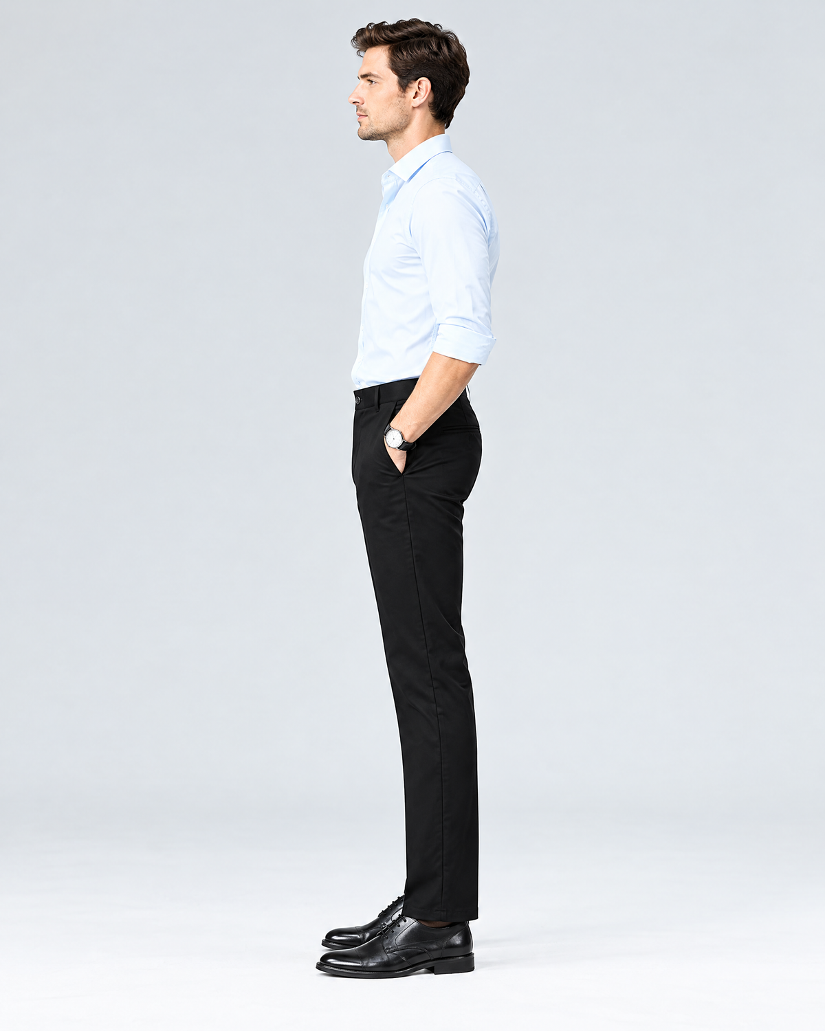Side profile of men's black slim straight stretch chino pants