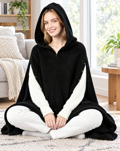 Woman wearing the Ainsley black heated hooded wearable blanket shawl